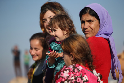 Refugiados yazidíes celebran la liberación de Sinjar, tomada por el Estado Islámico. (John Moore/Getty Images)